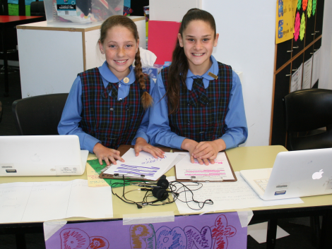 Students Halle and Olivia with their presentation