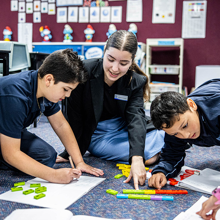 Teacher wiuth students at Our Lady of Lourdes Seven Hills